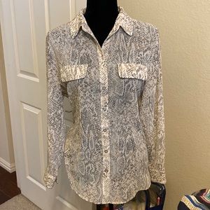 Long sleeve button up silky animal print blouse.